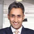 Person smiling in a professional setting.