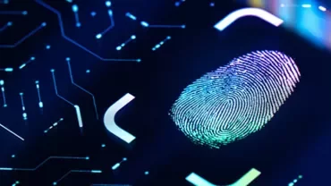 Digital fingerprint on a glowing touchpad interface.