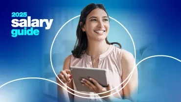 woman smiling and holding ipad