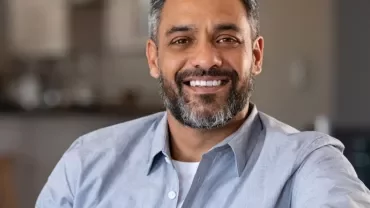 Smiling male professional in a modern office