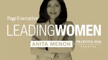 Portrait of a smiling professional with crossed arms, titled 'Leading Women' by PageExecutive and Prudential BSN.