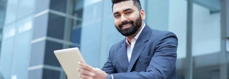 guy smiling with laptop