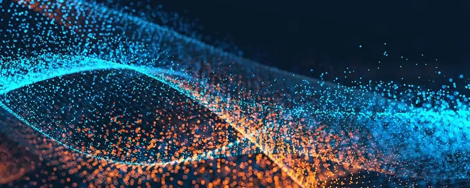 Abstract image of blue and orange particles forming waves.