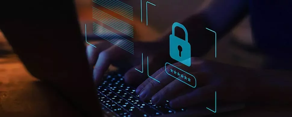 Hands typing on a laptop keyboard with digital lock security icon overlay.